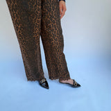 Leopard pants with floral embroidered hem