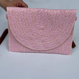 pink woven purse